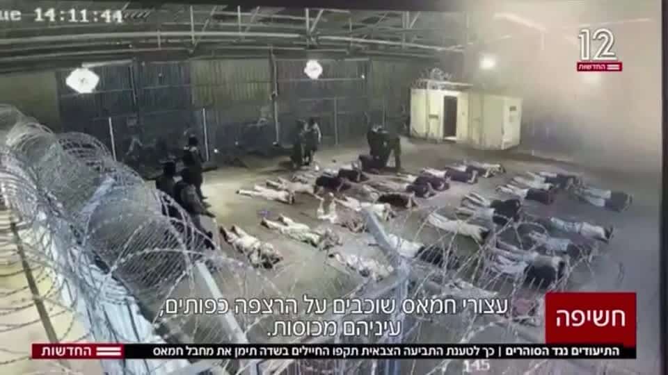 Surveillance footage reportedly showing blindfolded detainees lying on the floor under Israeli military guard at Sde Teiman prison.