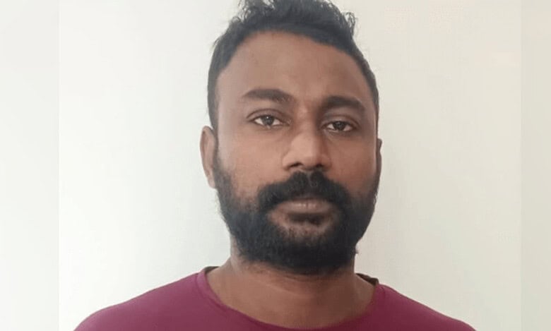 Portrait of Shameem KK, the accused, standing against a plain background.