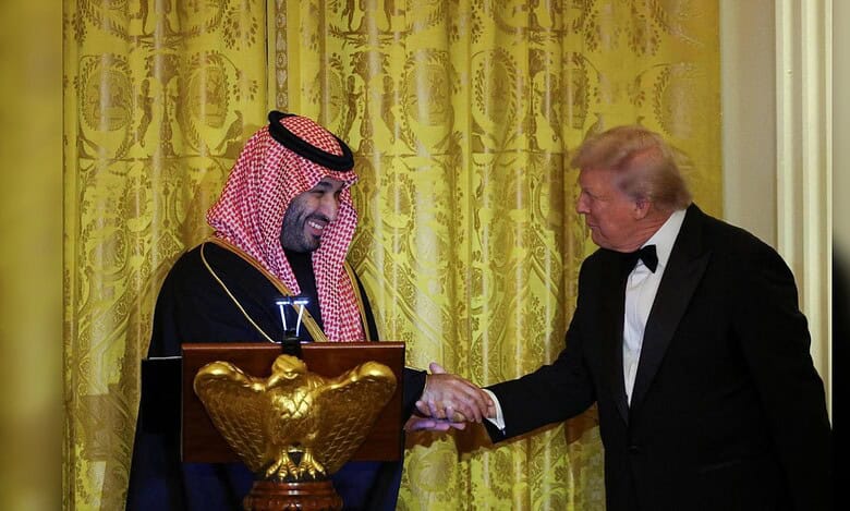 US President greets the Saudi Crown Prince during a White House dinner