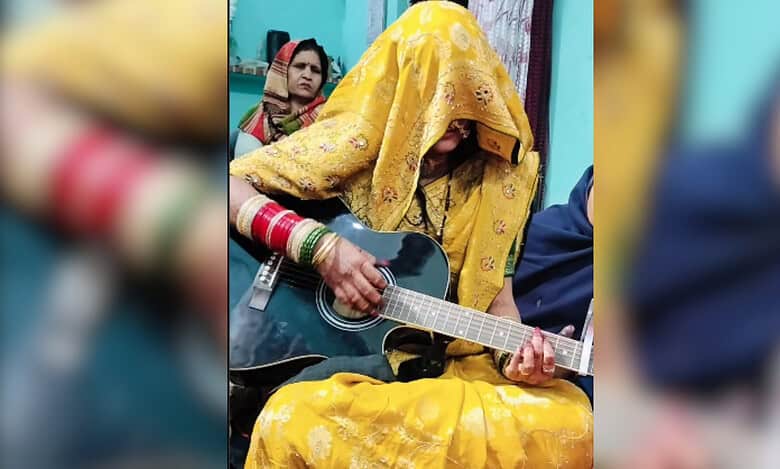 Ghunghat wearing newly married woman plays guitar, sparks debate
