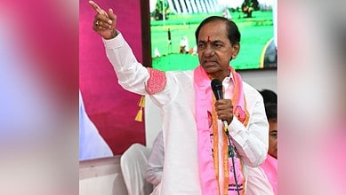 K. Chandrashekar Rao (KCR), BRS party leader, speaking at a public event in Telangana with pink party branding visible in the background