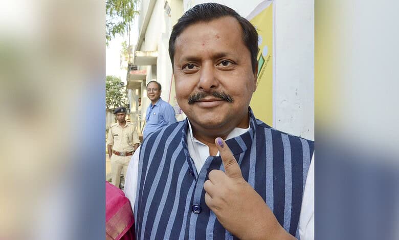 Bihar cabinet minister Nitin Nabin showing his inked finger after casting vote at a polling station