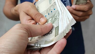 An officer taking a bribe.