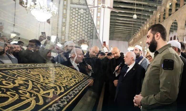 Syrian President Ahmed al-Sharaa reveals a piece of Kiswah in Damascuss