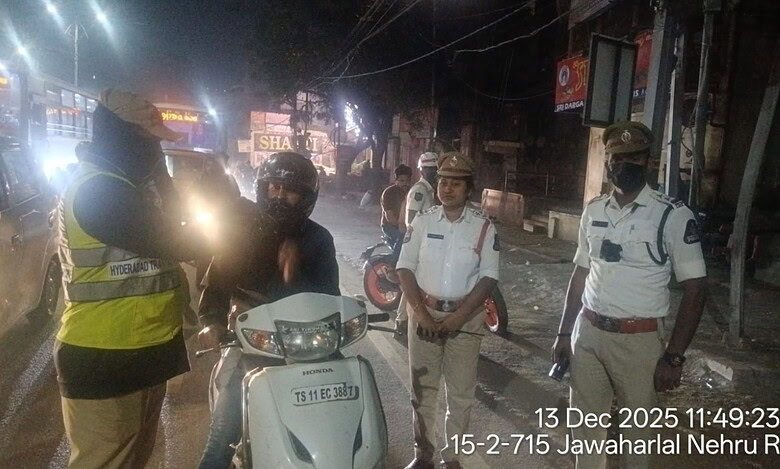 Police officials conduct a drunk driving check in Hyderabad'sKoti