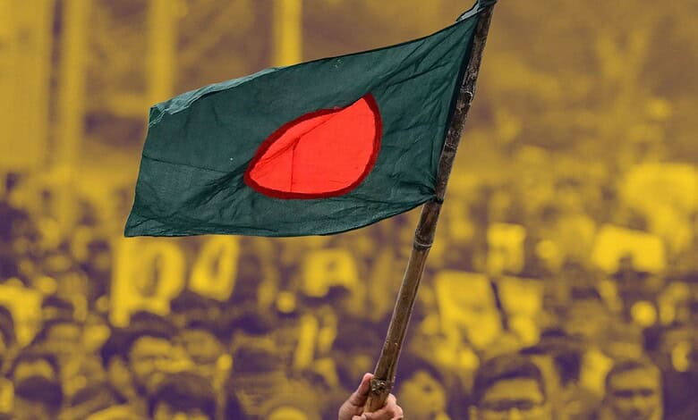 A Bangladeshi flag being raised in a protest.
