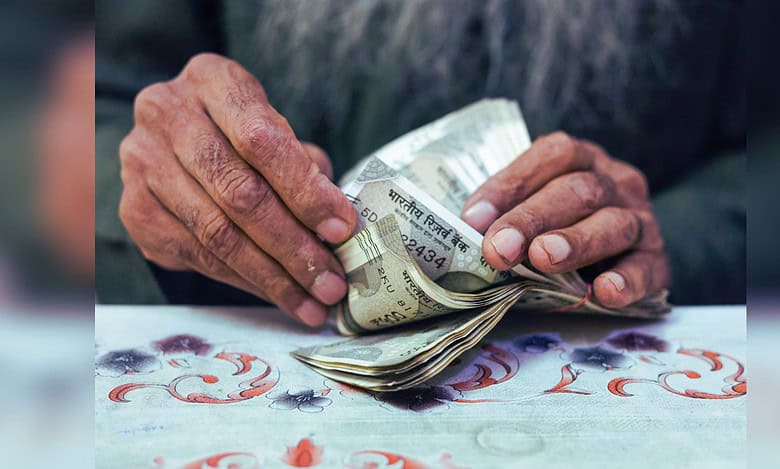Image showing man counting Indian currency