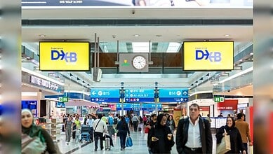 Passengers move through Dubai International Airport (DXB) terminal