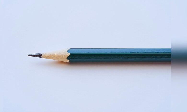 image showing a blue pencil on a gray background