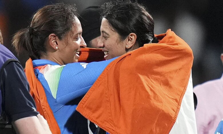 India's captain Harmanpreet Kaur, left, and vice captain Smriti Mandhana hold the Indian tricolour as they celebrates after winning the ICC Women's World Cup final ODI cricket match