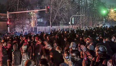 Iranians gather while blocking a street during a protest in Tehran, Iran on January 9. (MAHSA/Middle East Images)