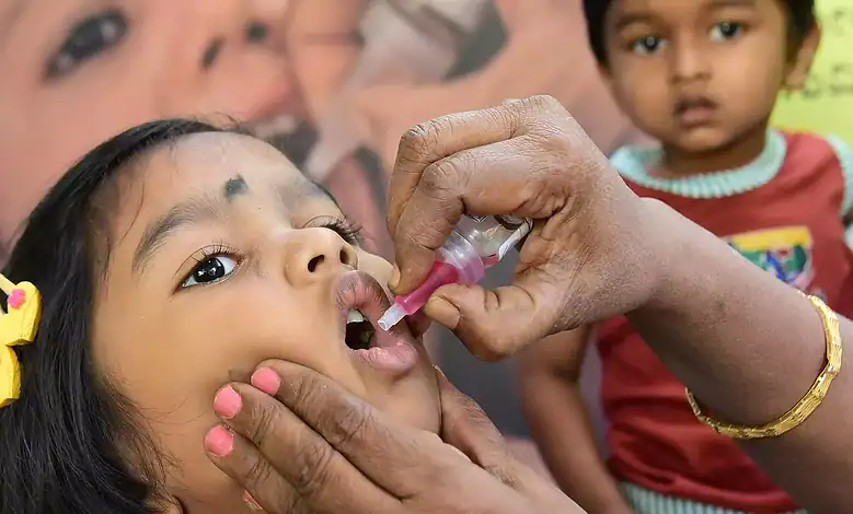 A child being administered a Polio vaccine.