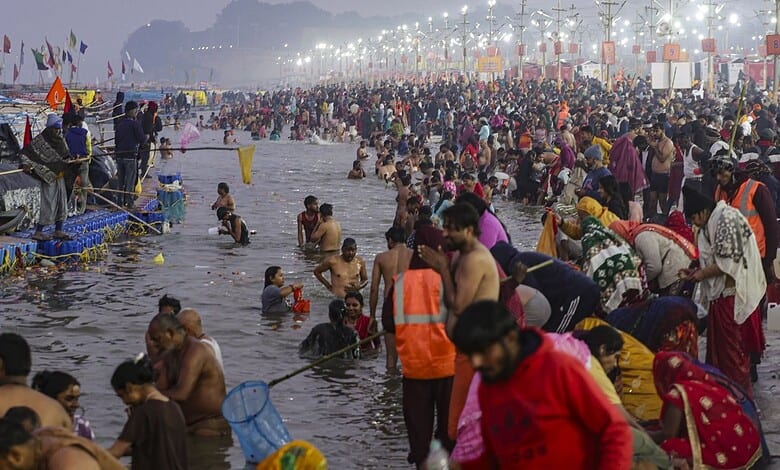 Devotees taking dip in Sangam on the occasion of 'Makar Sankranti' festival