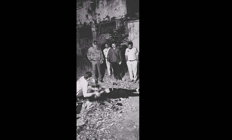 Police officials at the murder cite