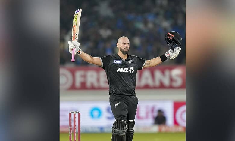 New Zealand's Daryl Mitchell celebrates his century during the second ODI cricket match between India and New Zealand at Niranjan Shah Stadium in Rajkot on Wednesday. (PTI Photo/Ravi Choudhary)