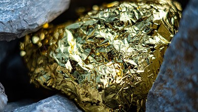 Gold nugget and grey granite stone