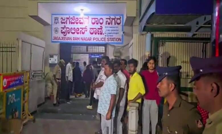 Devotees stand outside police station in Bengaluru