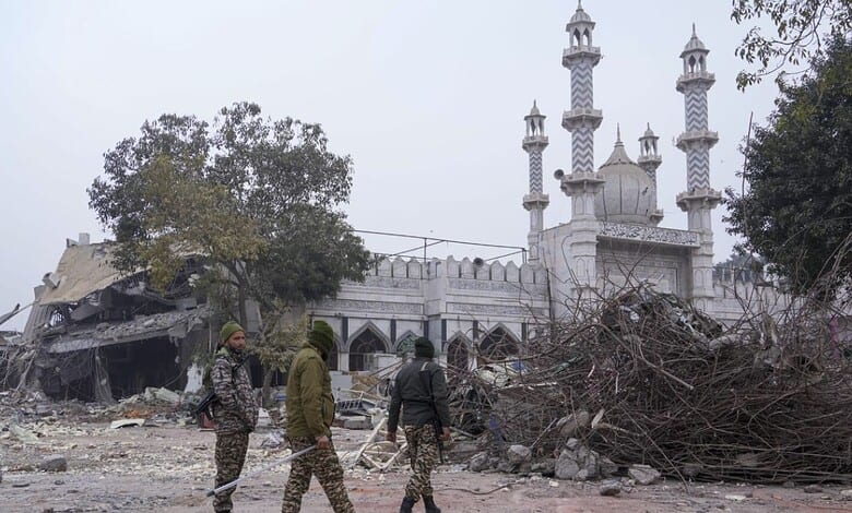 An excavator used in demolition of alleged encroachments stands amid rubble after the demolition of alleged encroachments on land adjoining the mosque, carried out by the Municipal Corporation of Delhi (MCD), in the Turkman Gate area of New Delhi, Thursday, Jan. 8, 2026.