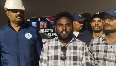 A rescued worker addresses the media