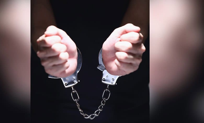 Image showing a pair of hands in handcuffs
