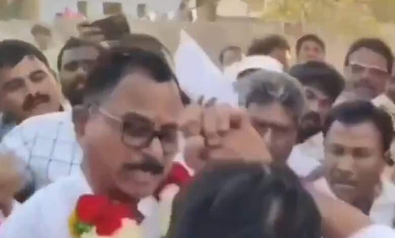 Image shows an altercation between Bharat Rashtra Samithi MLA Vijayudu and Congress MP Mallu Ravi