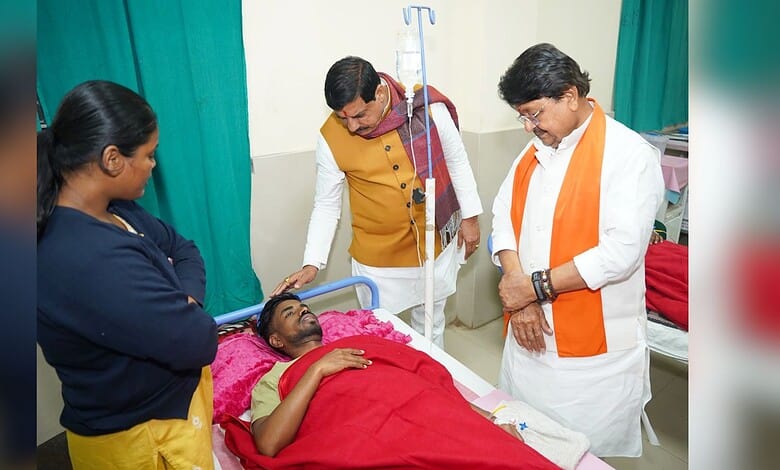 Madhya Pradesh Chief Minister Mohan Yadav and Minister Kailash Vijayvargiya meet an affected person undergoing treatment after consumption of contaminated water, at a hospital in Indore.