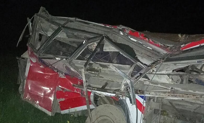 A bus is mangled after falling from a hill in Nepal