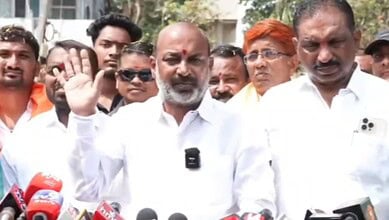 Union Minister speaking to supporters during GHMC election campaign in Hyderabad, focusing on voter suppo.