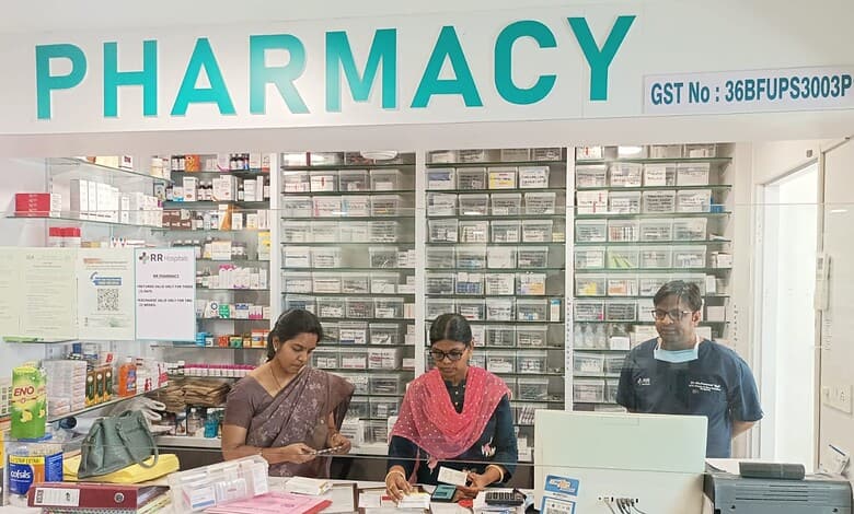 Pharmacy interior with staff assisting customers in a well-stocked drugstore.