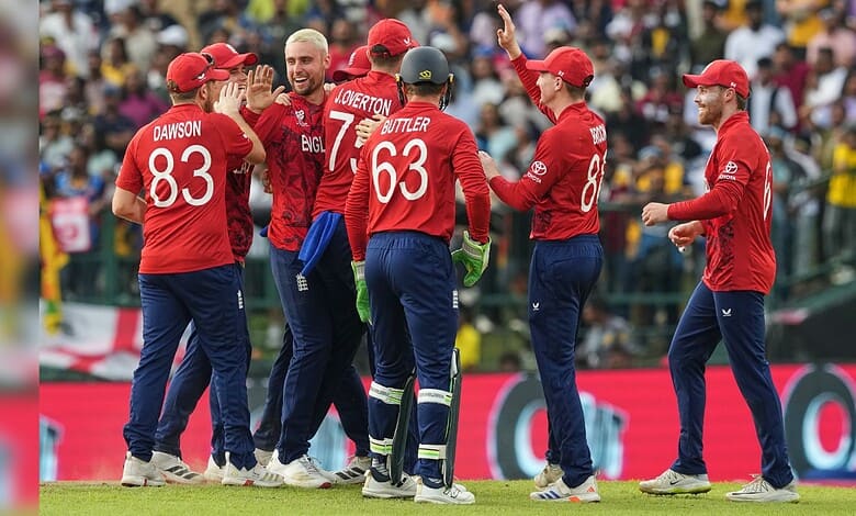 England cricket players celebrating after a wicket in T20 World Cup match.
