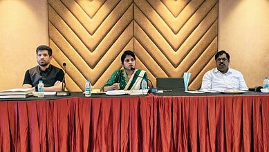 Telangana medical tourism conference with healthcare professionals discussing medical travel options.