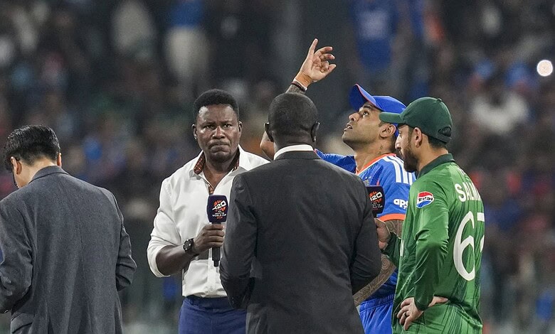 India's captain Suryakumar Yadav flips the coin as Pakistan's captain Salman Agha takes the call during the toss before an ICC Men's T20 World Cup 2026 cricket match between India and Pakistan,