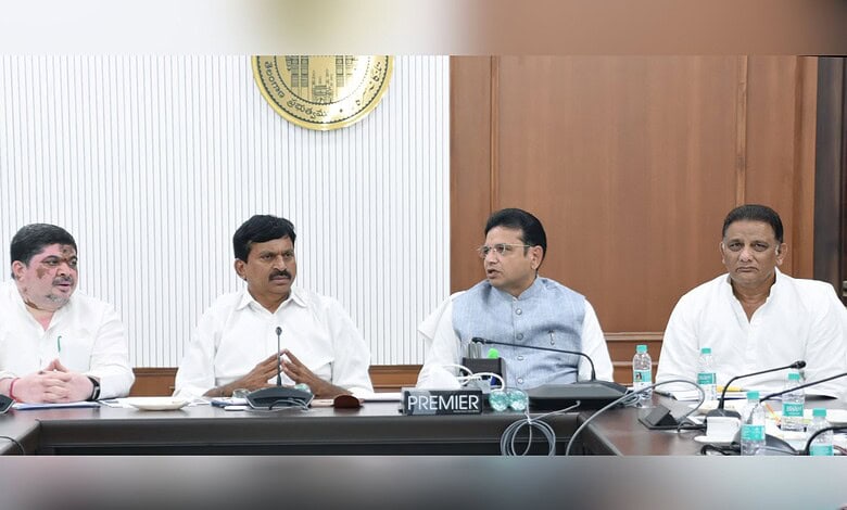 Officials seated at a conference table during a formal meeting.