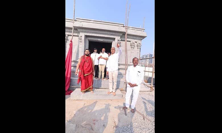 Temple construction site with officials and workers in Telangana.