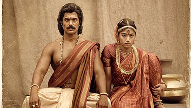 Actors in traditional Indian wedding attire, portraying a scene from a historical or cultural film.