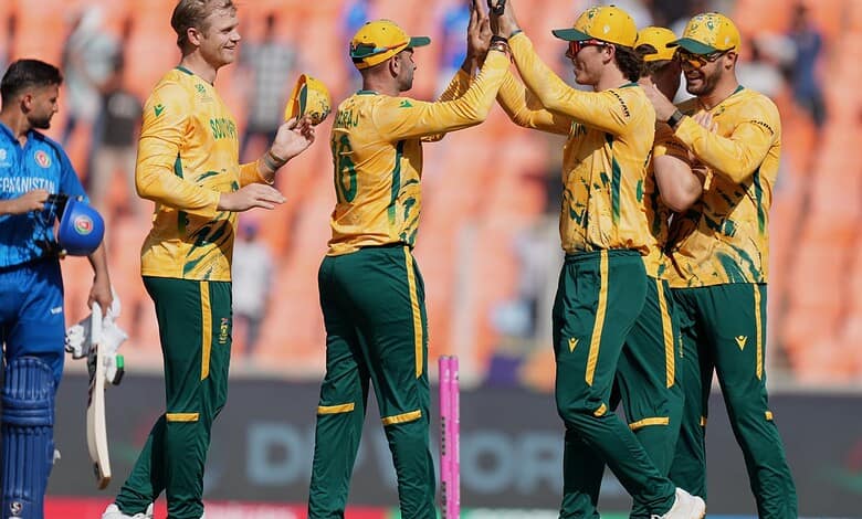 South Africa cricketers celebrate the win over Afghanistan in super over during the T20 World Cup cricket match between Afghanistan and South Africa in Ahmedabad.