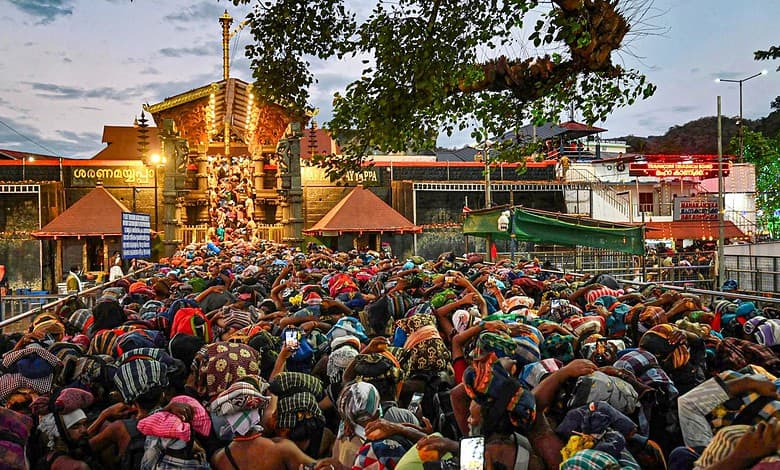 Pathanamthitta: Rush of people as they wait to offer prayers at the Sabarimala temple ahead of the 'Makaravilakku' festival, in Pathanamthitta district, Kerala, Tuesday, Jan. 13, 2026. (PTI Photo)