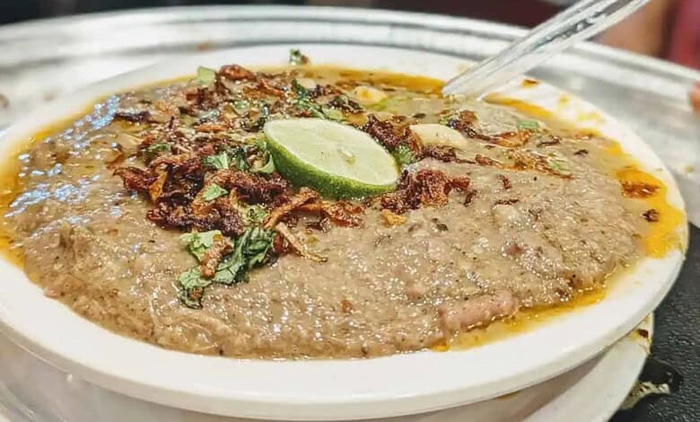 Delicious Hyderabad Haleem with beef, spices, and garnishes, served in a traditional bowl during Ramzan c.