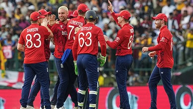 England cricket team celebrating during a match at the T20 World Cup.
