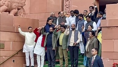 Opposition MPs raise slogans after staging a walkout from the Rajya Sabha during Prime Minister Narendra Modi reply to the Motion of Thanks to the President's address at the Budget session of Parliament on Thursday. (PTI Photo)(PTI02_05_2026_000263B)