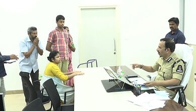 Hyderabad Police Commissioner VC Sajjanar interacts with a woman during the Meet Your CP programme