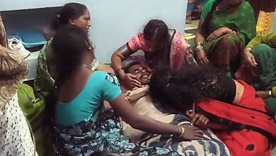 Family members surround Mahadev's body
