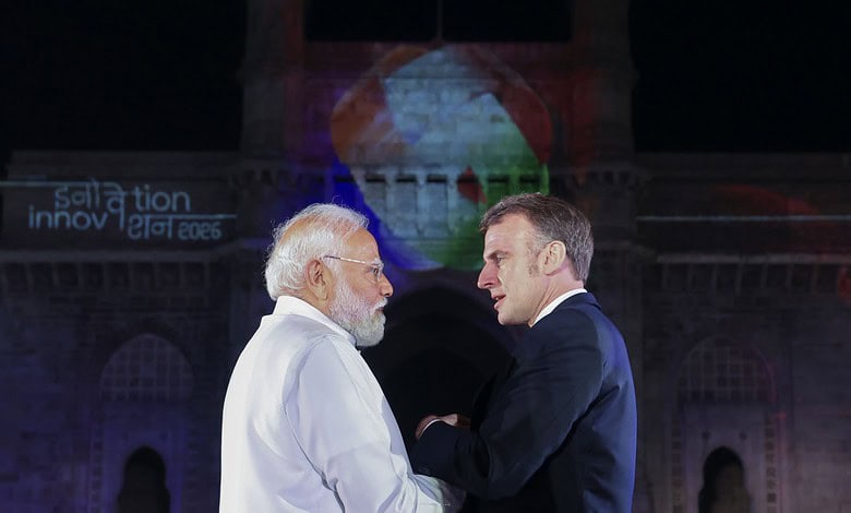 French President Macron meeting Indian officials in Mumbai during his visit.