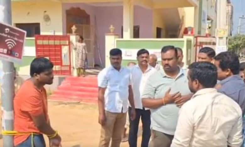 Man arguing with a group of men in Telangana after a violent incident.
