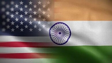 Indian and US flags waving together, symbolising upcoming trade negotiations from Feb 23.