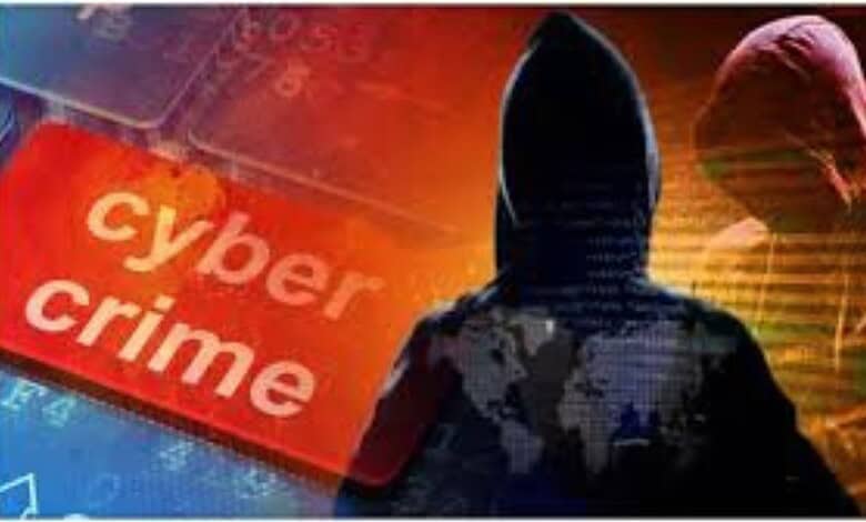 Cyber crime warning sign with hooded hacker silhouette.