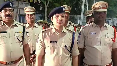 Police officers at Banswada addressing communal clash, maintaining law and order.