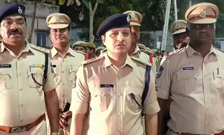 Police officers at Banswada addressing communal clash, maintaining law and order.