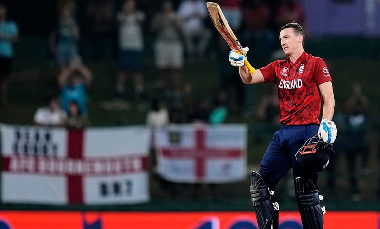 England cricketer celebrating after scoring during T20 World Cup match, advancing to semi-finals.