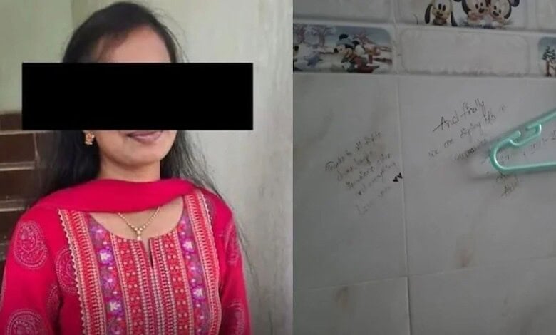 Photo of a young woman in traditional attire with a black bar over her eyes, next to a wall with handwrit.